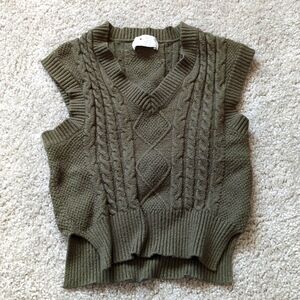 green sweater vest
